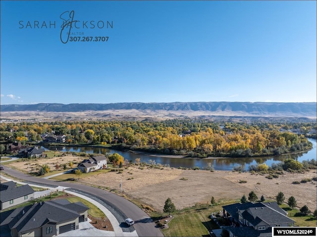 bird's eye view featuring a water and mountain view