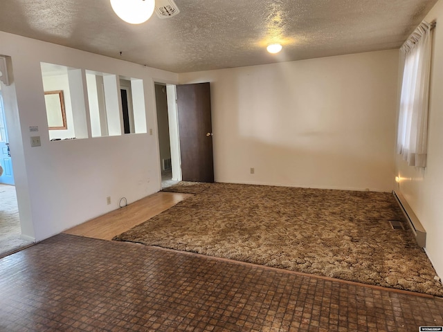 empty room with a textured ceiling