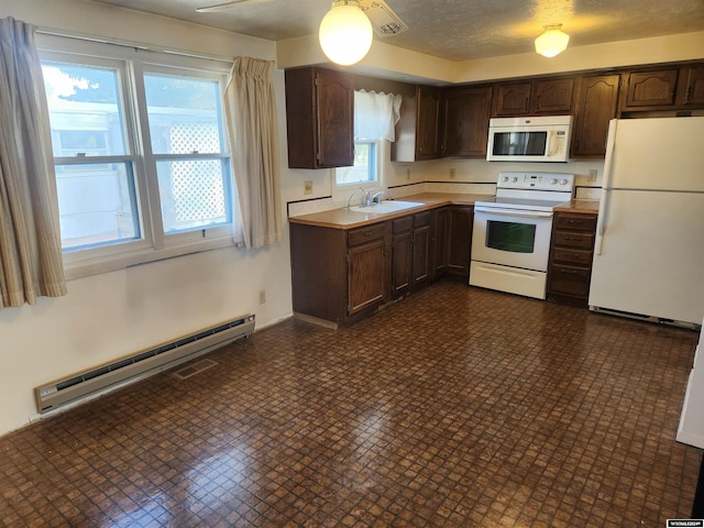 kitchen featuring white appliances, dark brown cabinetry, a textured ceiling, a baseboard heating unit, and sink