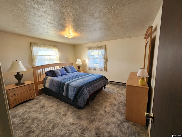 bedroom featuring a baseboard radiator, multiple windows, a textured ceiling, and dark colored carpet