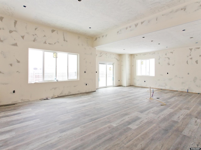 spare room with light wood-type flooring and visible vents