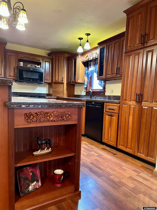 36 County Road 211, Riverside, WY 82325 - kitchen with dishwasher, light hardwood / wood-style flooring, decorative light fixtures, and a textured ceiling