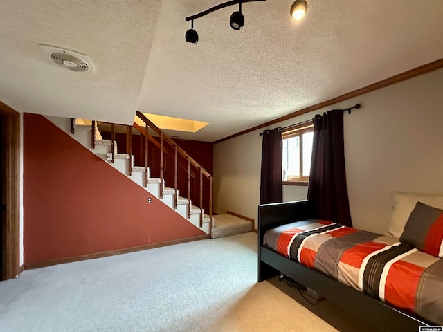 36 County Road 211, Riverside, WY 82325 - bedroom with ornamental molding, a textured ceiling, and carpet