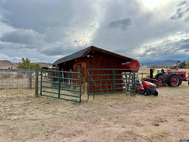36 County Road 211, Riverside, WY 82325 - view of horse barn with a mountain view