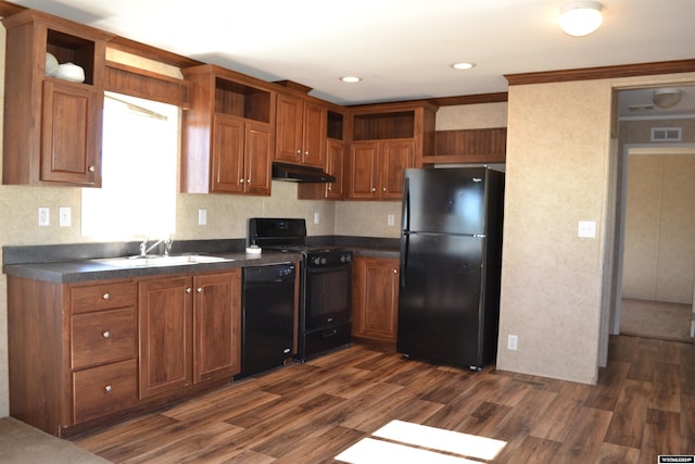 kitchen featuring ornamental molding, black appliances, sink, and dark hardwood / wood-style flooring