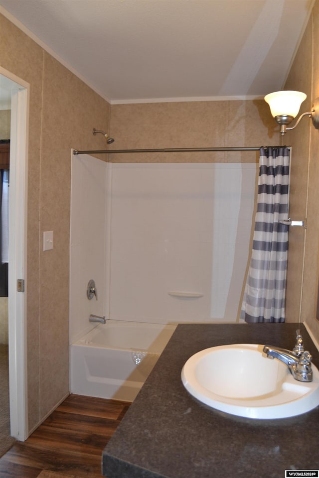 bathroom featuring vanity, crown molding, shower / tub combo with curtain, and hardwood / wood-style flooring