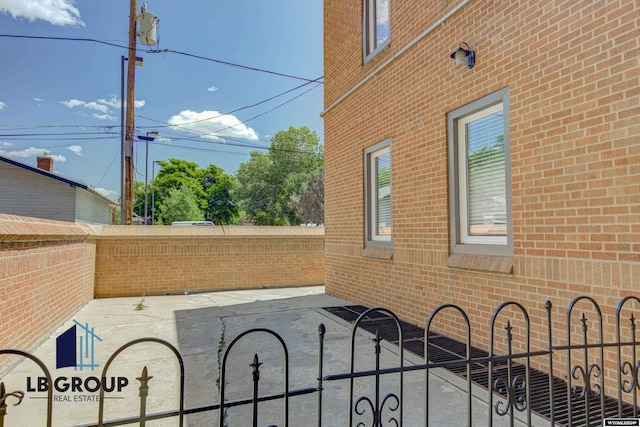 view of side of property with a patio area