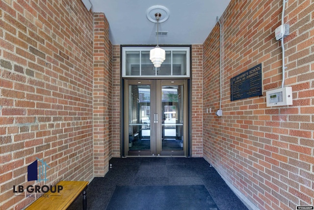 view of exterior entry featuring french doors