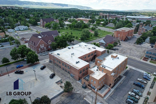 birds eye view of property with a mountain view