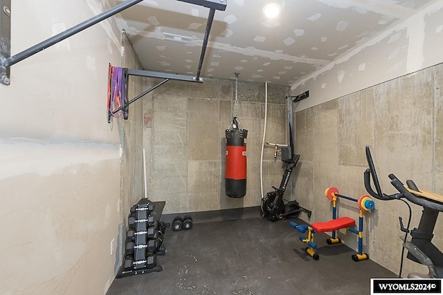 workout area featuring concrete floors