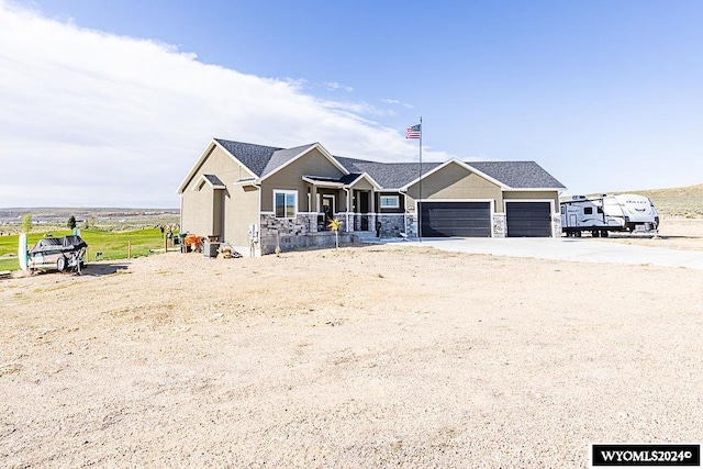 view of front facade with covered porch and a garage