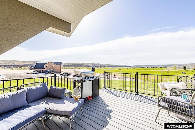 deck with outdoor lounge area and grilling area