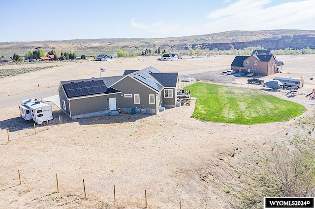 birds eye view of property with a mountain view