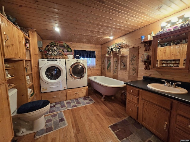 43 Red Cliff Dr, Lander, WY 82520 - full bath with wood-type flooring, vanity, washer and dryer, wood ceiling, and a freestanding bath