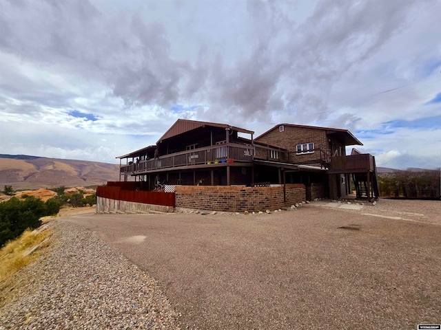 back of house featuring a mountain view