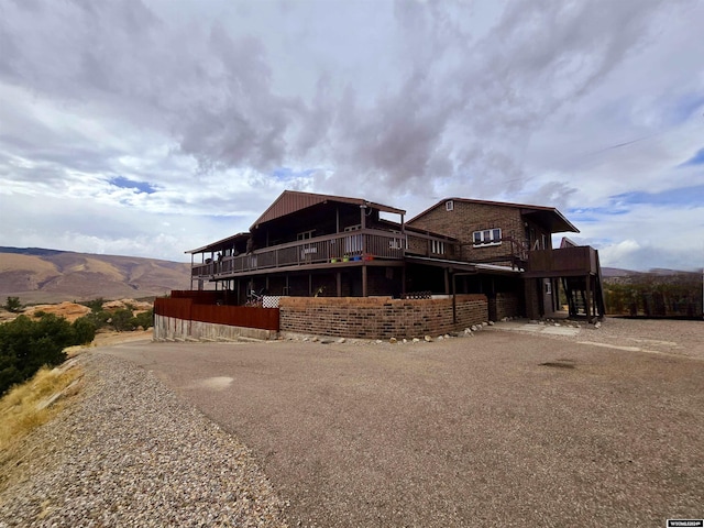 43 Red Cliff Dr, Lander, WY 82520 - back of property with a wooden deck