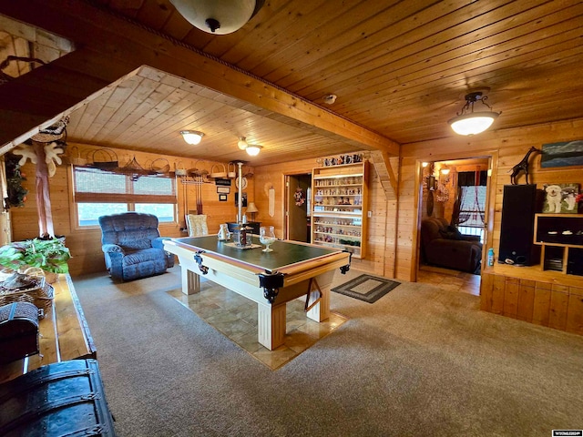 rec room with wood ceiling, light colored carpet, and wood walls