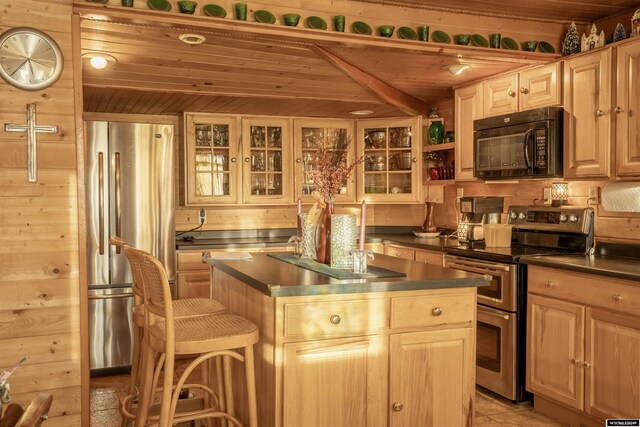 43 Red Cliff Dr, Lander, WY 82520 - kitchen with stainless steel appliances, dark countertops, and wooden ceiling