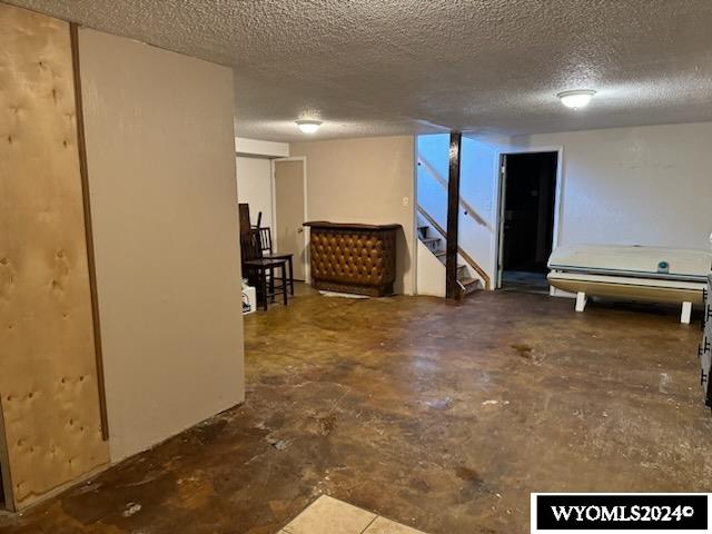 basement with a textured ceiling