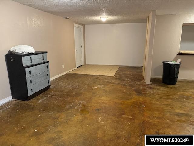 basement with a textured ceiling