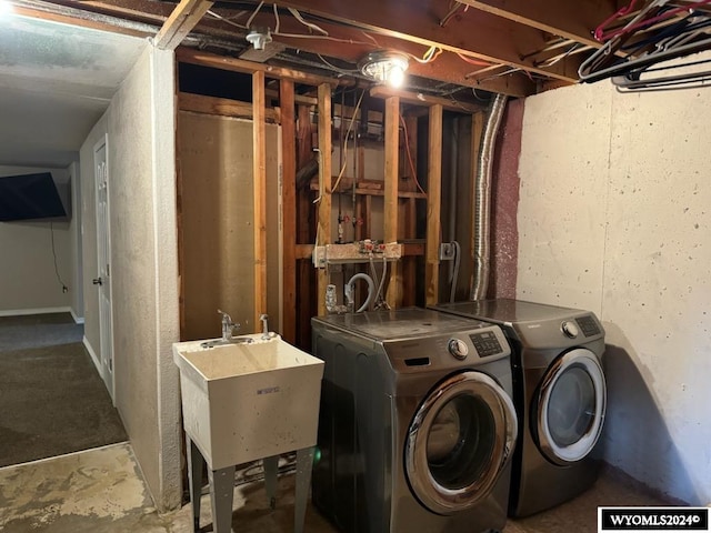 laundry room with sink and washing machine and clothes dryer