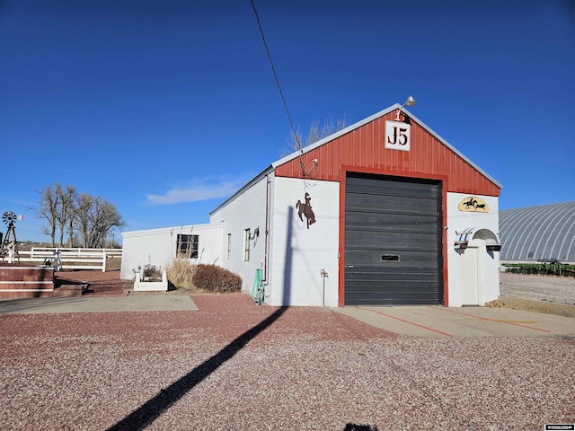 4380 US Highway 26-85, Torrington, WY 82240 - view of outbuilding featuring fence, concrete driveway, and an outdoor structure