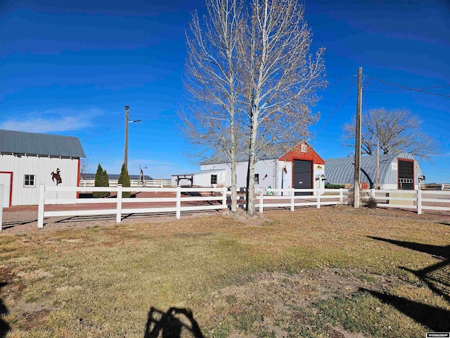 view of yard with an outbuilding and a garage