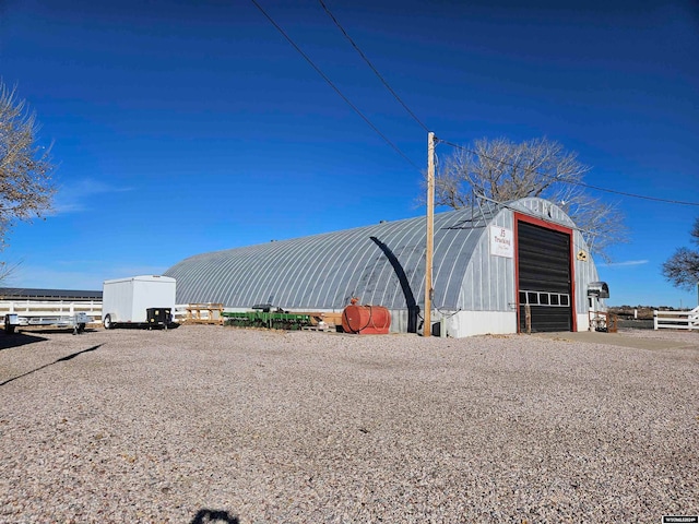 exterior space featuring an outbuilding