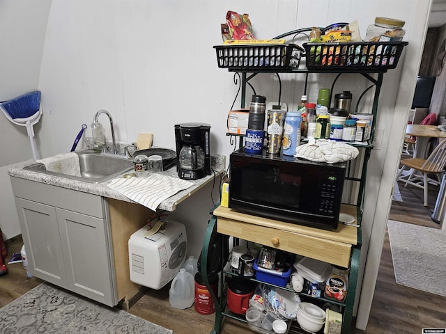 4380 US Highway 26-85, Torrington, WY 82240 - bar area featuring black microwave, a sink, and wood finished floors