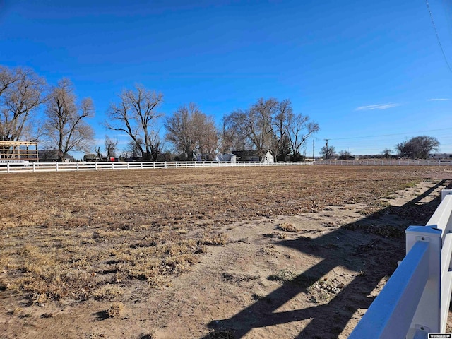 view of yard with a rural view