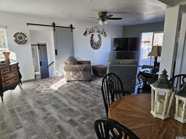 4380 US Highway 26-85, Torrington, WY 82240 - dining room with a barn door, a ceiling fan, and wood finished floors