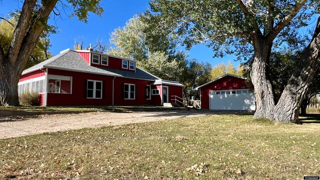 58 Bethel Rd, Buffalo, WY 82834 - view of front of house with an outdoor structure, a front yard, and a garage
