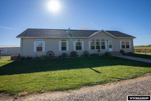 ranch-style home with a front lawn