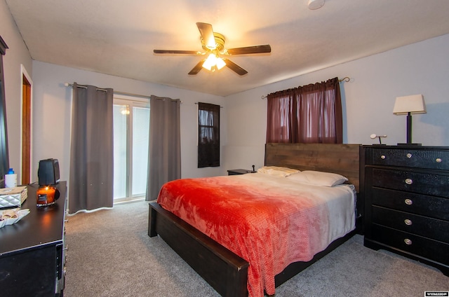 bedroom featuring light carpet and ceiling fan