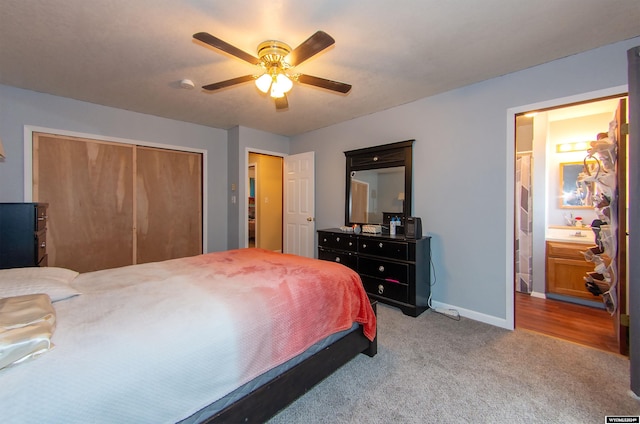 bedroom with a closet, ceiling fan, and carpet floors