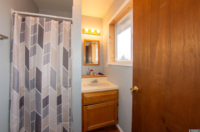 bathroom featuring vanity and walk in shower