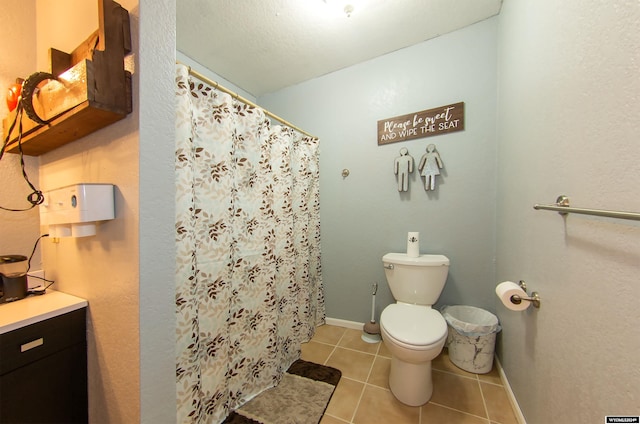 bathroom featuring vanity, tile patterned floors, curtained shower, and toilet