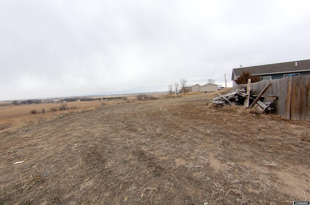 view of yard with a rural view