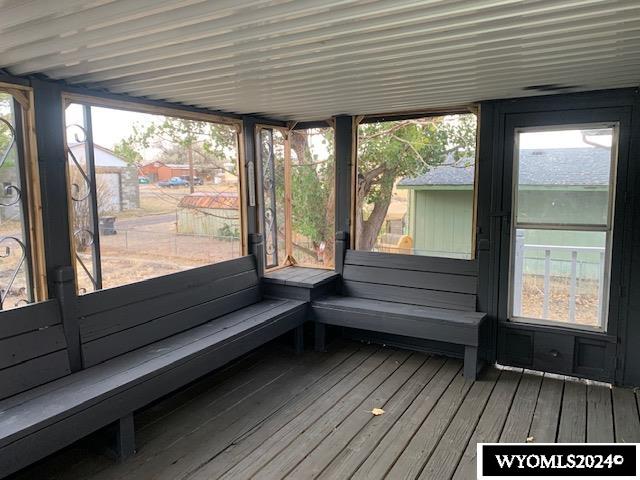 unfurnished sunroom featuring a healthy amount of sunlight