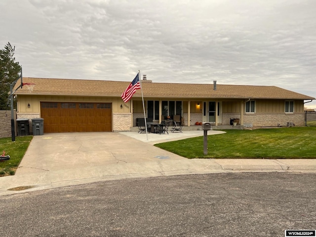 single story home with a front lawn and a garage