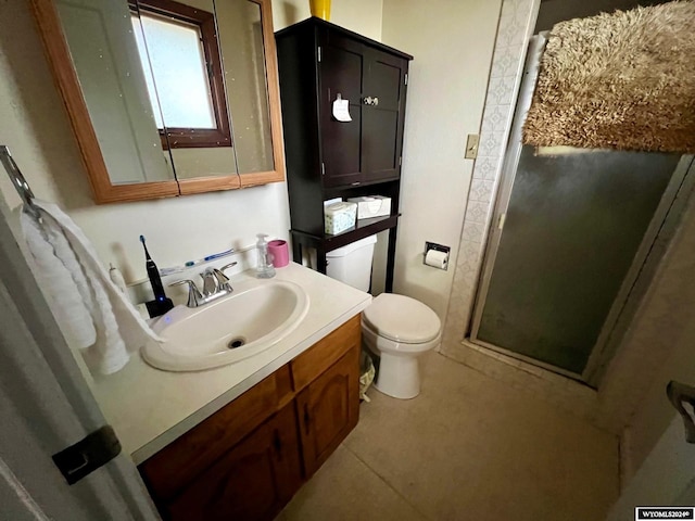 bathroom with vanity, toilet, and walk in shower