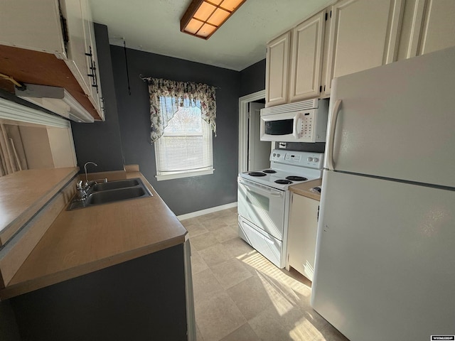 kitchen with sink and white appliances