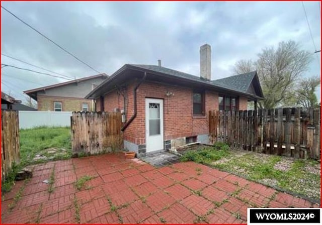 rear view of property featuring a patio