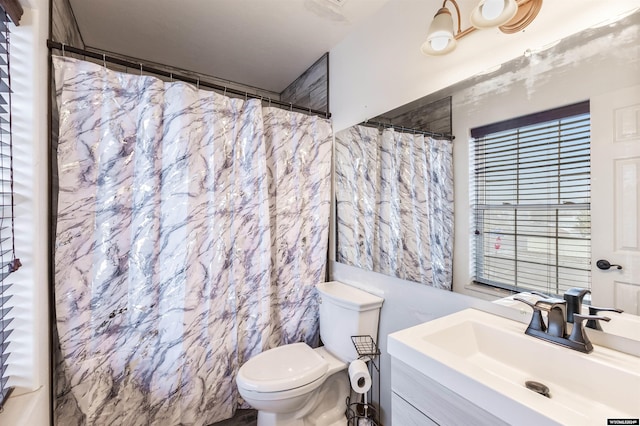 bathroom with vanity, toilet, tile walls, and a shower with shower curtain