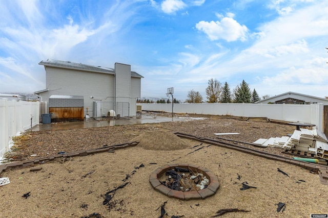 view of yard with a patio area and a fire pit