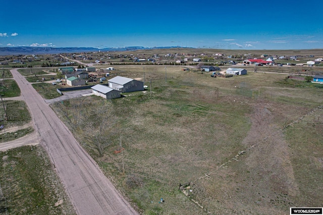 birds eye view of property featuring a rural view