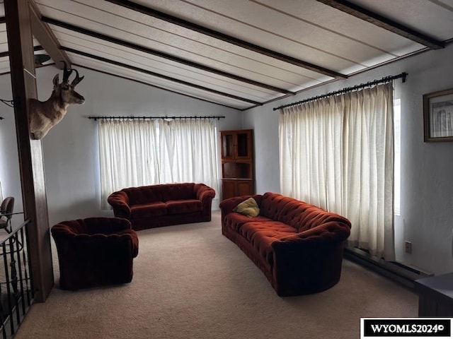 living room with carpet floors and vaulted ceiling with beams