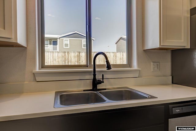 kitchen with sink and dishwashing machine