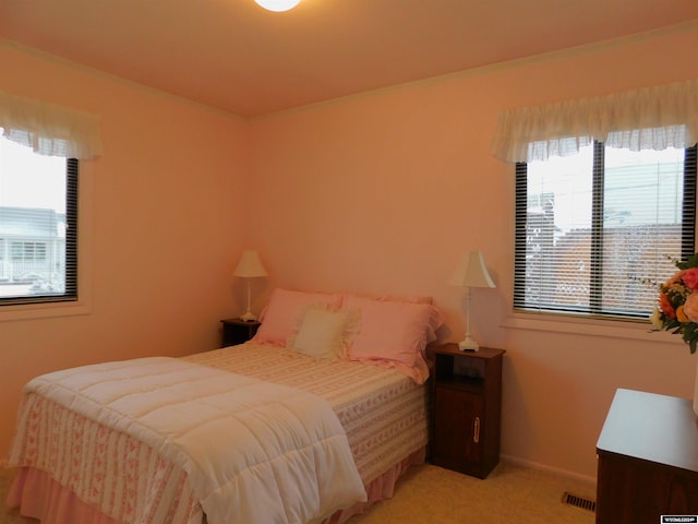 bedroom with light carpet