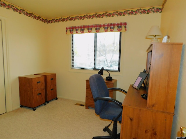 home office with light colored carpet